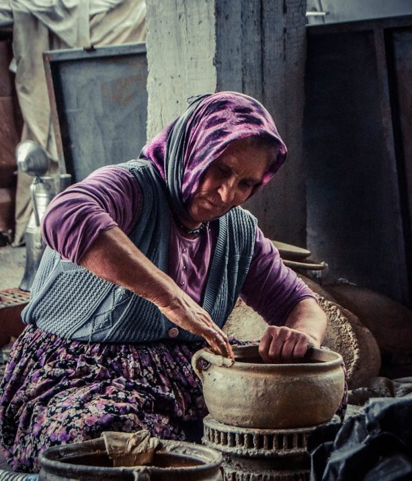 Woman Molding Brown Clay Pot