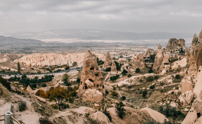From above of picturesque view of ancient rough carved stone buildings in Cappadocia